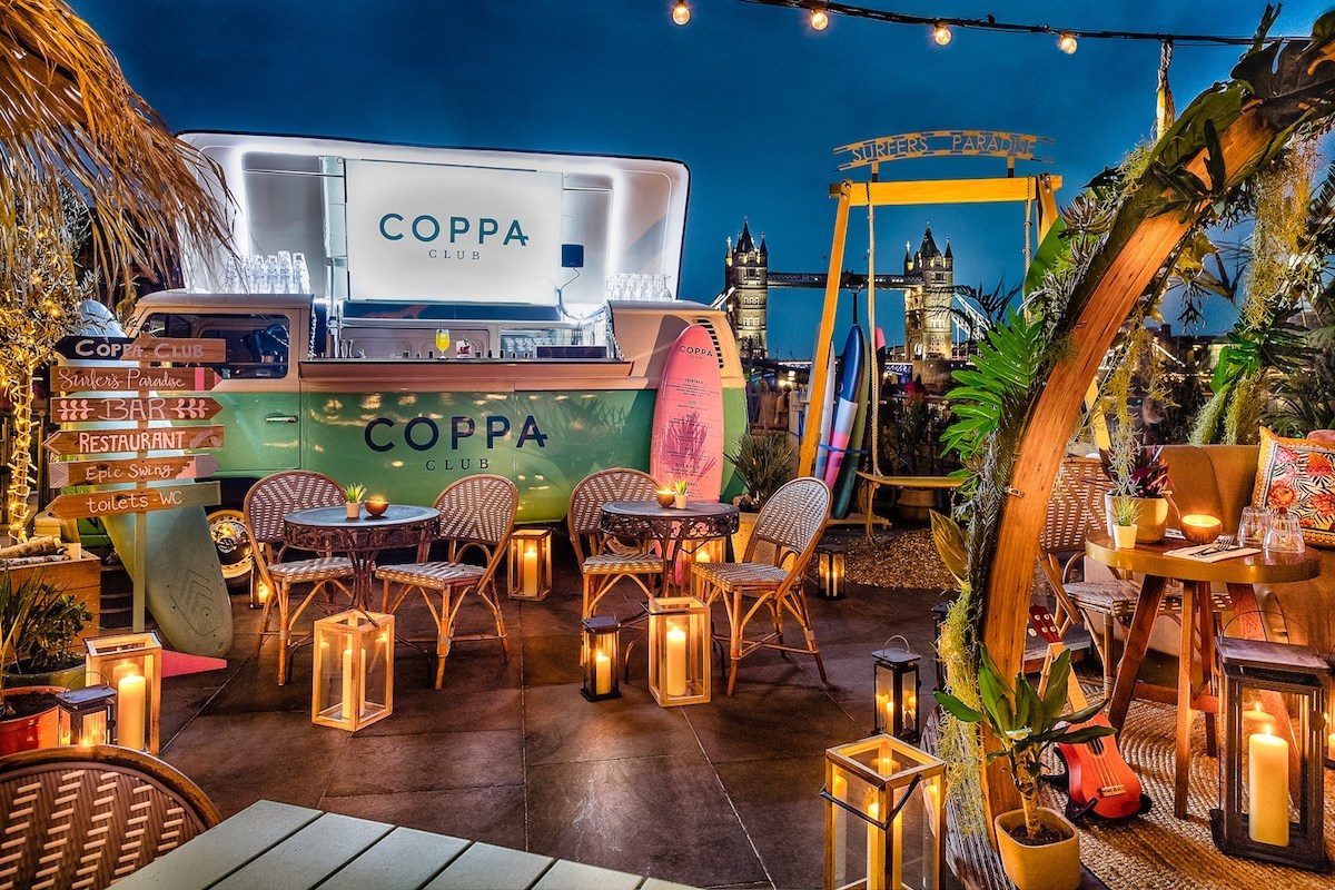 Fully branded Coppa Club vehicle bar on the Thames terrace beneath Tower Bridge