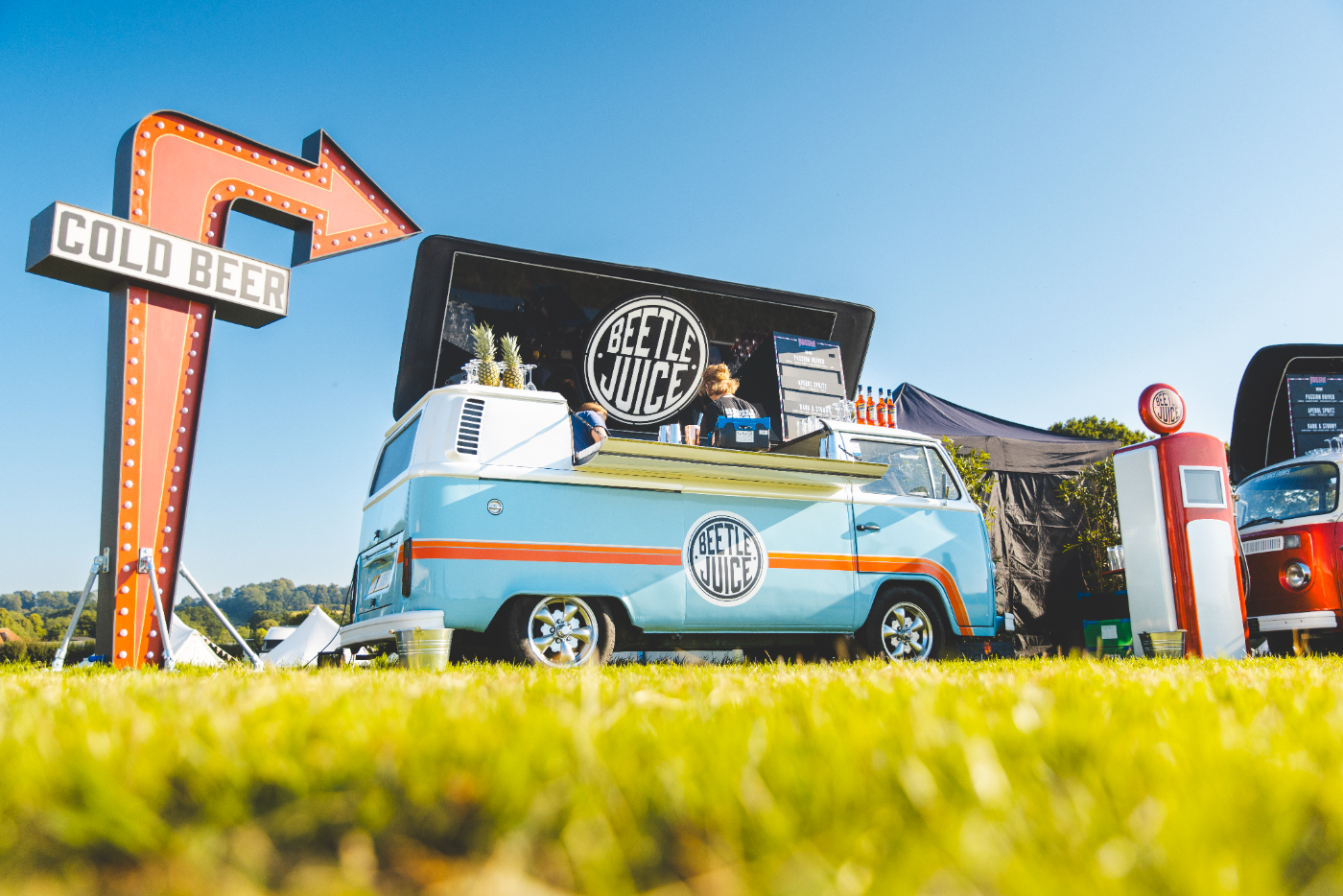 Beetle Juice VW bar at an outdoor festival on a sunny day