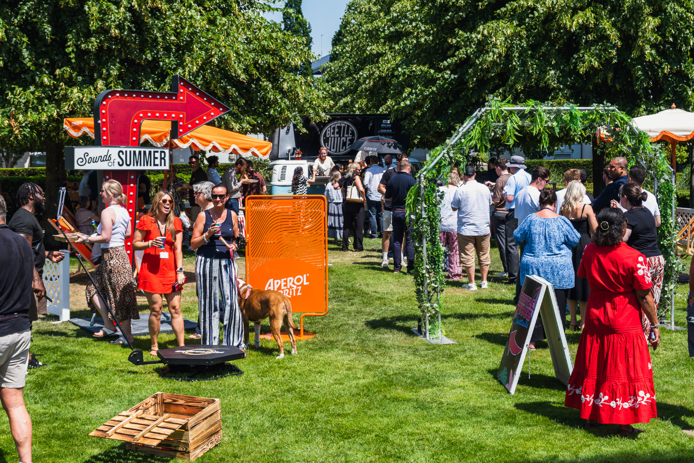 Crowd enjoying an Aperol garden party activation
